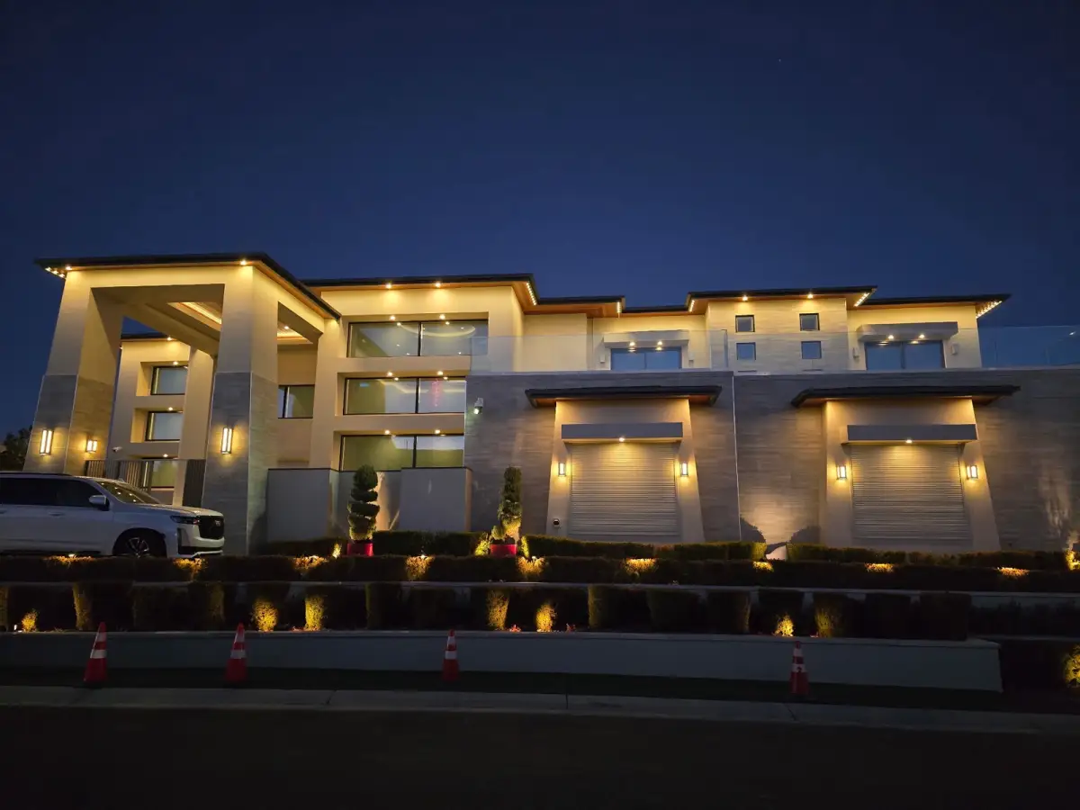 Warm white LED roofline lighting at dusk