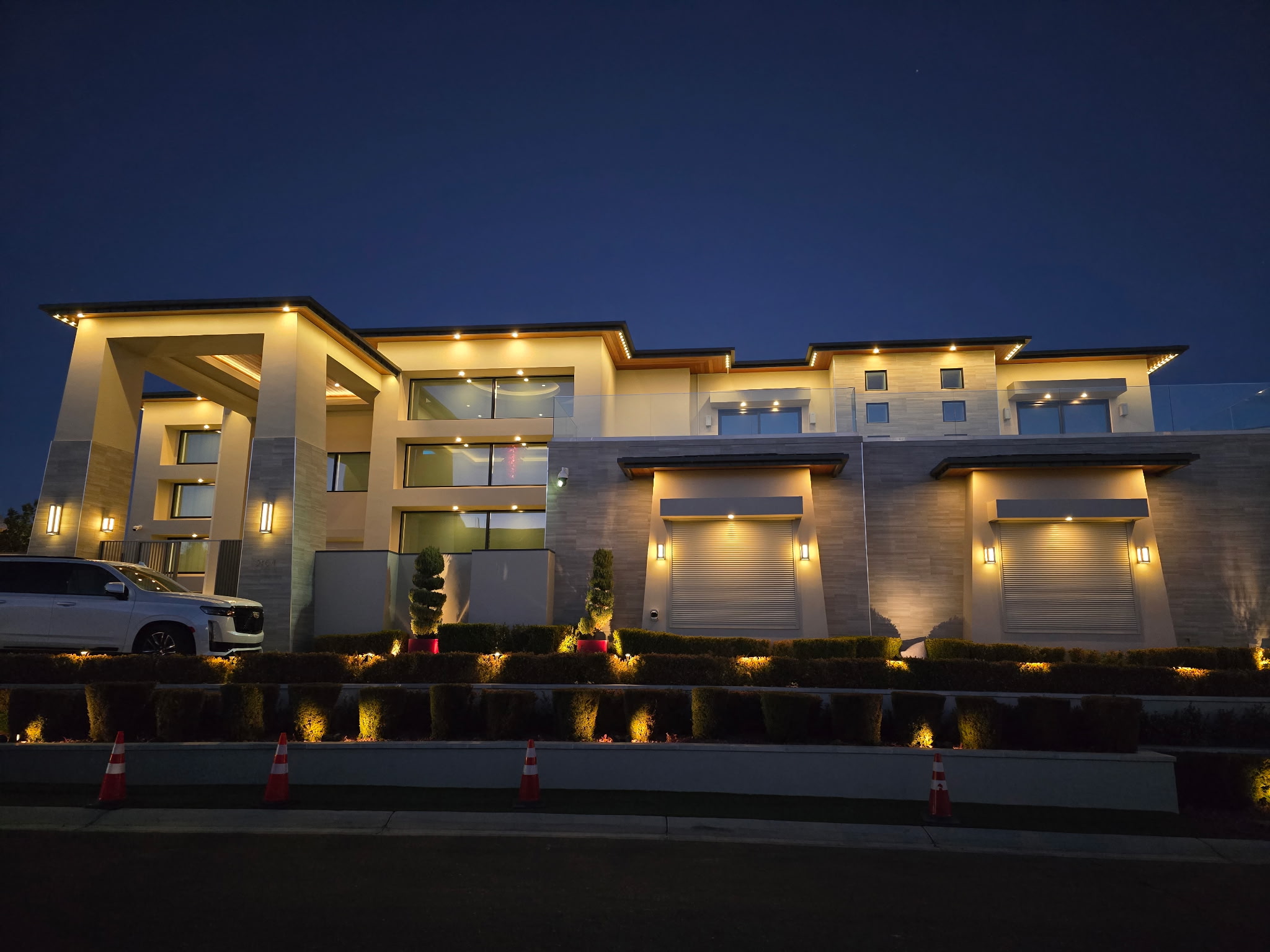 Warm white LED roofline lighting at dusk