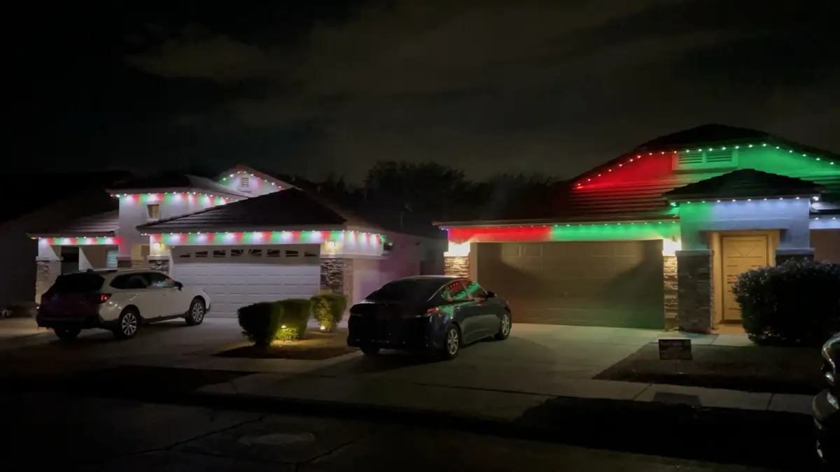 Multi-color LED lighting on two-story home in Elkhorn